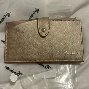 NWT Travellambo rose gold wallet for women. Great for travel.